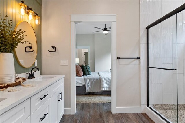 18 Beechwood Ln, Linn Valley, KS 66040 - full bath featuring ceiling fan, double vanity, wood finished floors, ensuite bathroom, and a stall shower