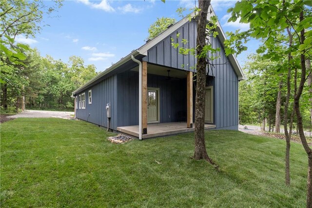 18 Beechwood Ln, Linn Valley, KS 66040 - rear view of house featuring a yard and board and batten siding