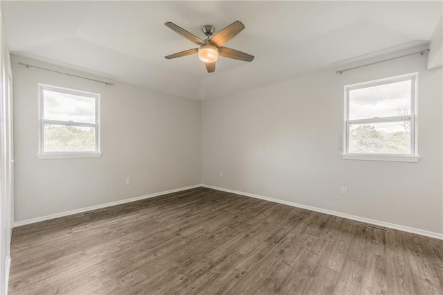 10908 Indiana Ave, Kansas City, MO 64137 - empty room with a ceiling fan, wood finished floors, and baseboards