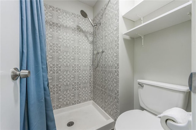 10908 Indiana Ave, Kansas City, MO 64137 - bathroom with tiled shower and toilet