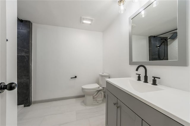 10908 Indiana Ave, Kansas City, MO 64137 - bathroom featuring vanity, marble finish flooring, toilet, and baseboards