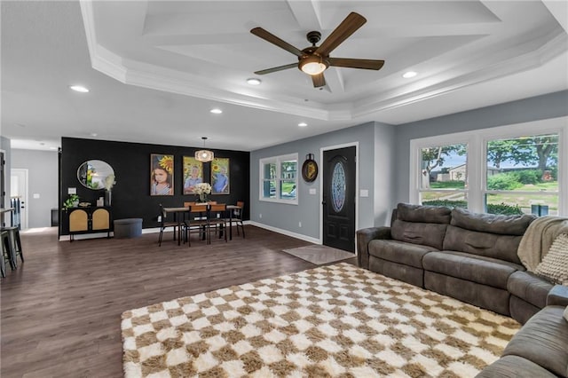 807 N Main St, Carrollton, MO 64633 - living area with a raised ceiling, dark wood-style floors, a ceiling fan, recessed lighting, and ornamental molding