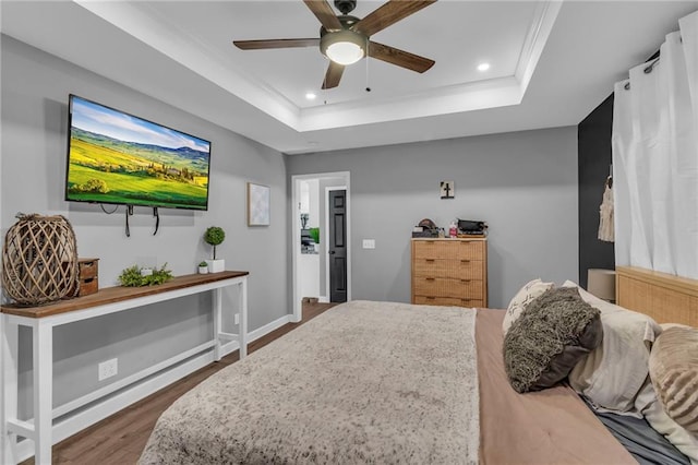 807 N Main St, Carrollton, MO 64633 - bedroom featuring a raised ceiling, dark wood-type flooring, recessed lighting, crown molding, and a ceiling fan
