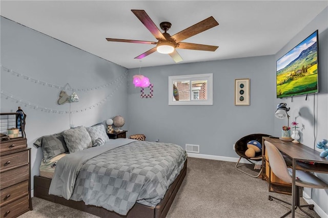 807 N Main St, Carrollton, MO 64633 - carpeted bedroom with baseboards and ceiling fan