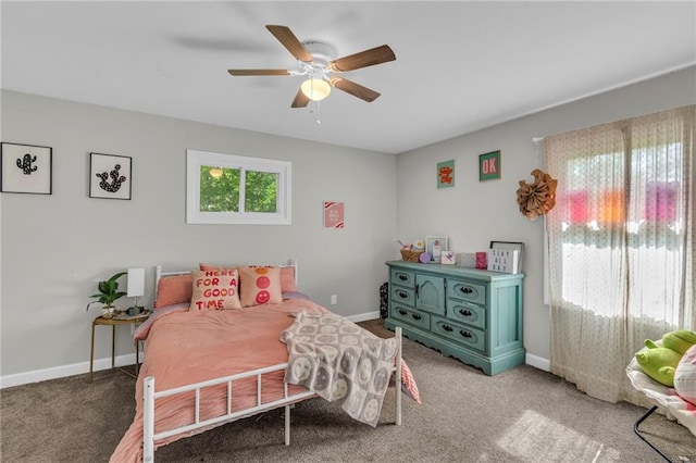 807 N Main St, Carrollton, MO 64633 - carpeted bedroom with baseboards and ceiling fan