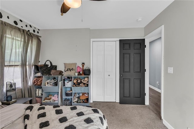 807 N Main St, Carrollton, MO 64633 - bedroom with a closet, carpet, a ceiling fan, and baseboards