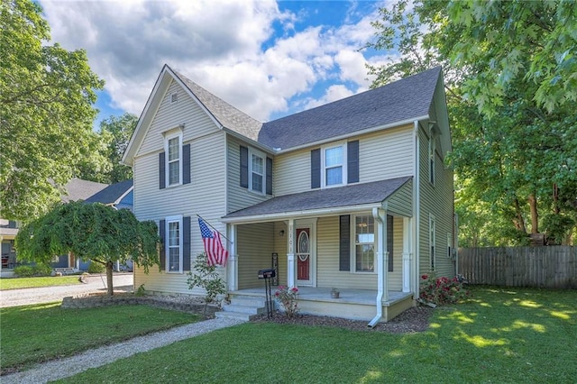 1101 S Independence St, Harrisonville, MO 64701 - view of front of home featuring a porch and roof with shingles