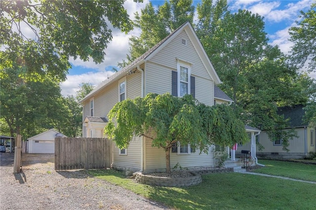 1101 S Independence St, Harrisonville, MO 64701 - view of front of house featuring an outdoor structure and a detached garage