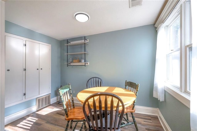 1101 S Independence St, Harrisonville, MO 64701 - dining area with dark wood finished floors and baseboards