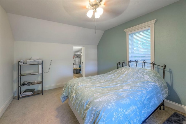 1101 S Independence St, Harrisonville, MO 64701 - bedroom featuring lofted ceiling, light carpet, baseboards, a ceiling fan, and a walk in closet