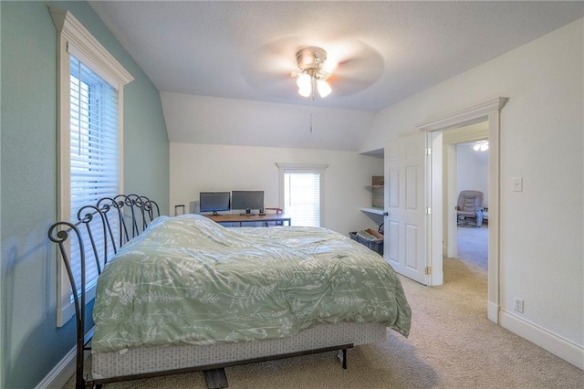 1101 S Independence St, Harrisonville, MO 64701 - carpeted bedroom featuring vaulted ceiling, a ceiling fan, and baseboards
