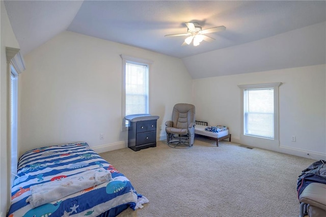 1101 S Independence St, Harrisonville, MO 64701 - carpeted bedroom featuring vaulted ceiling, multiple windows, a ceiling fan, and baseboards