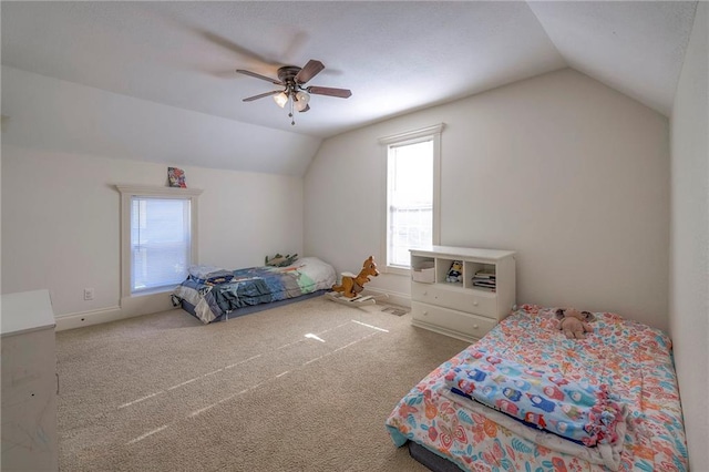 1101 S Independence St, Harrisonville, MO 64701 - carpeted bedroom with lofted ceiling, ceiling fan, and baseboards