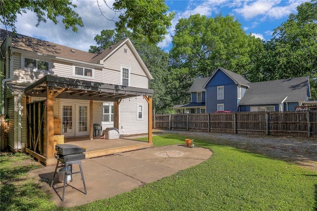 1101 S Independence St, Harrisonville, MO 64701 - back of property featuring french doors and a patio area
