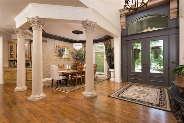 14301 Briar St, Leawood, KS 66224 - entrance foyer with decorative columns, french doors, crown molding, and wood finished floors