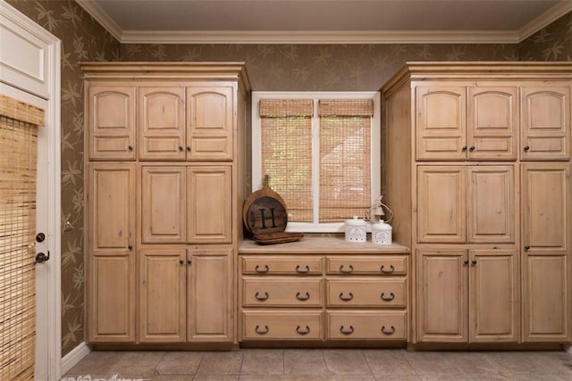 14301 Briar St, Leawood, KS 66224 - kitchen with wallpapered walls, light brown cabinetry, light countertops, and crown molding