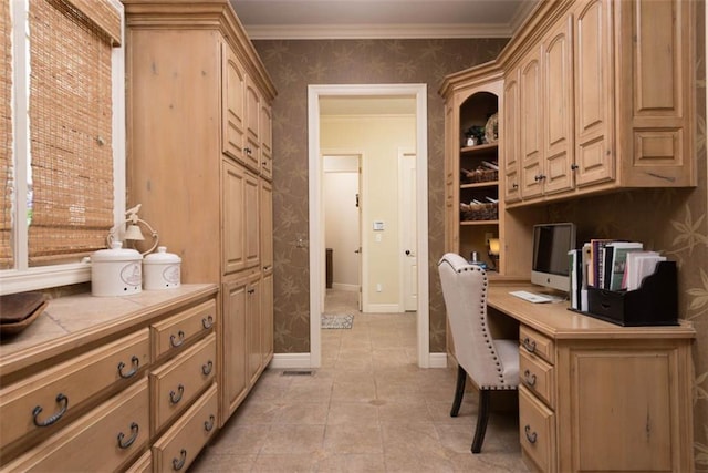 14301 Briar St, Leawood, KS 66224 - office with wallpapered walls, built in desk, and ornamental molding