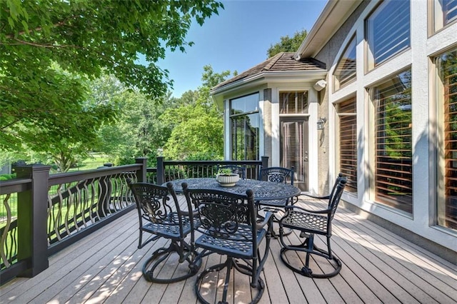 14301 Briar St, Leawood, KS 66224 - wooden deck with outdoor dining area