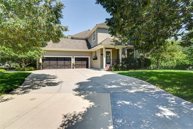 14301 Briar St, Leawood, KS 66224 - view of front of property with a garage, a front yard, driveway, and stucco siding