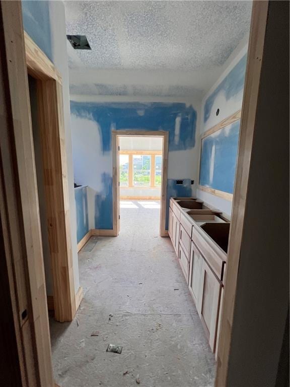16500 Ingalls St, Gardner, KS 66030 - bathroom featuring a textured ceiling and double vanity