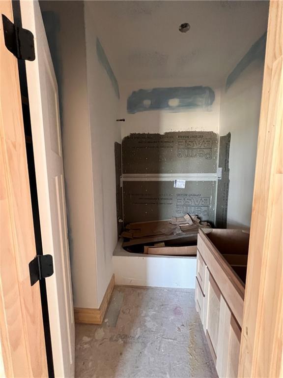 16500 Ingalls St, Gardner, KS 66030 - bathroom featuring unfinished concrete flooring