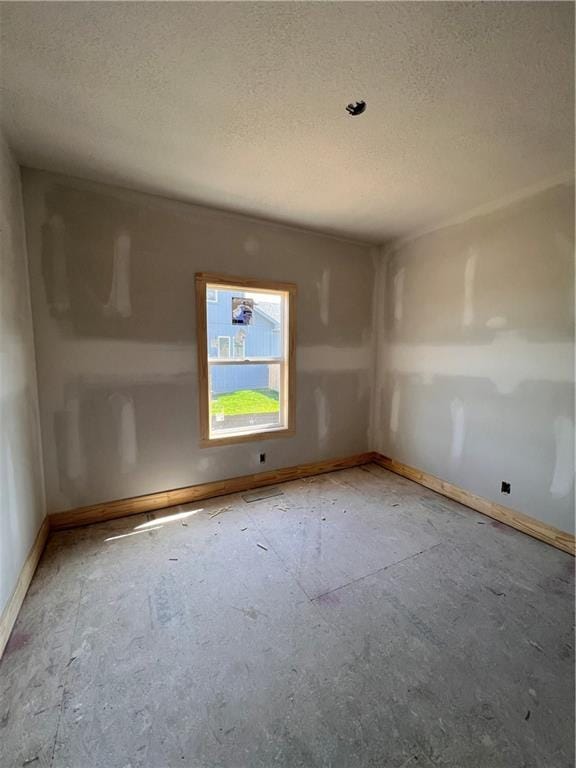 16500 Ingalls St, Gardner, KS 66030 - unfurnished room featuring a textured ceiling and baseboards