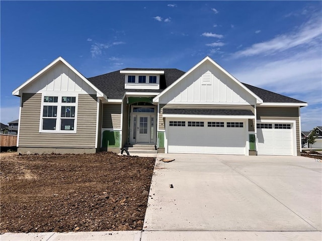 16500 Ingalls St, Gardner, KS 66030 - craftsman house with board and batten siding, an attached garage, driveway, and a shingled roof