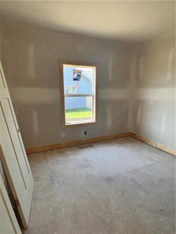 16500 Ingalls St, Gardner, KS 66030 - unfurnished room with baseboards and concrete flooring