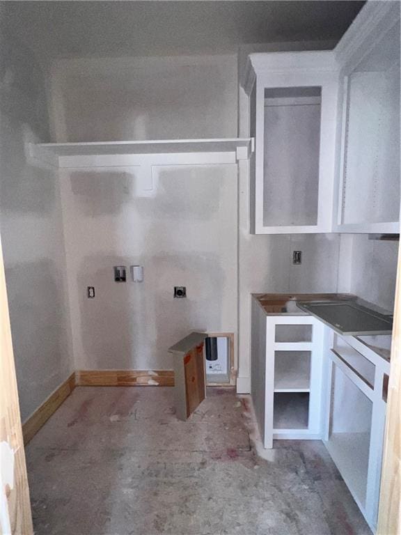 16500 Ingalls St, Gardner, KS 66030 - bathroom featuring baseboards and unfinished concrete floors