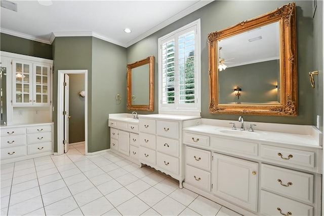 13905 Lucille St, Overland Park, KS 66221 - bathroom featuring crown molding, double vanity, tile patterned flooring, and a ceiling fan