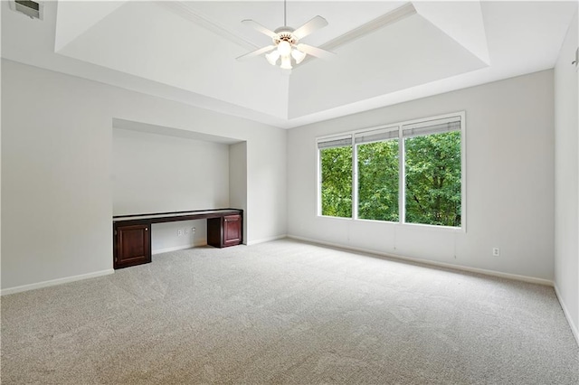 13905 Lucille St, Overland Park, KS 66221 - carpeted empty room featuring a tray ceiling, a ceiling fan, and a desk