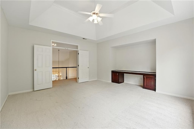 13905 Lucille St, Overland Park, KS 66221 - unfurnished bedroom featuring carpet floors, a raised ceiling, and ceiling fan