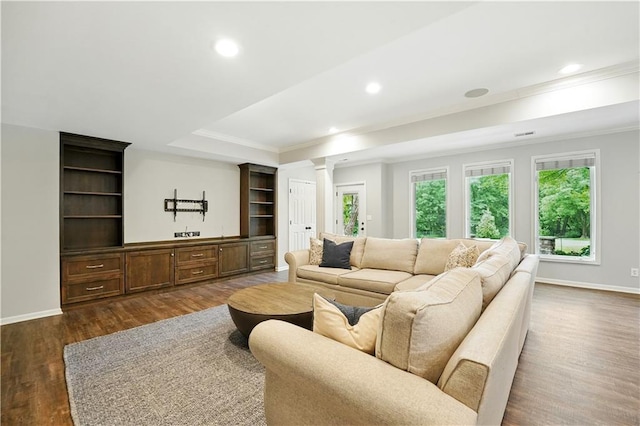 13905 Lucille St, Overland Park, KS 66221 - living area featuring ornate columns, ornamental molding, dark wood finished floors, recessed lighting, and a raised ceiling