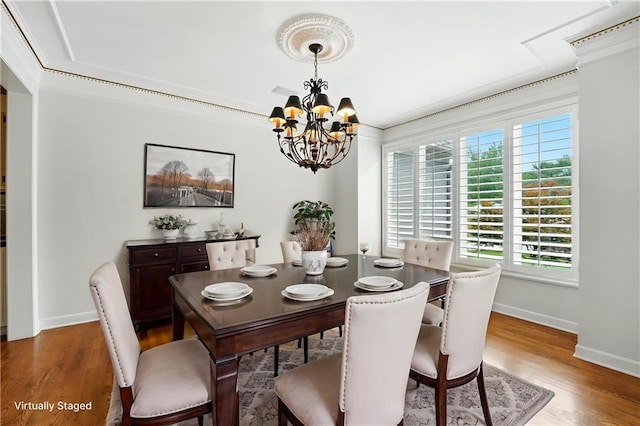 13905 Lucille St, Overland Park, KS 66221 - dining area with a chandelier and wood finished floors