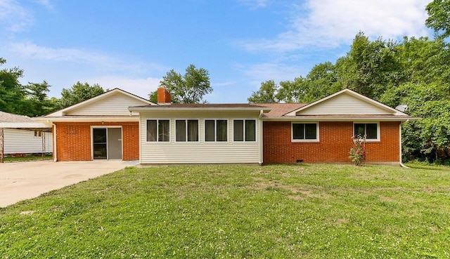 1036 Vilas St, Leavenworth, KS 66048 - ranch-style house featuring brick siding, a front yard, a chimney, and crawl space