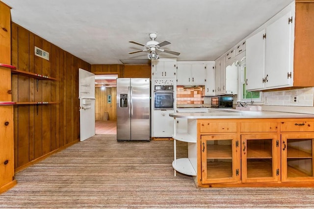 1036 Vilas St, Leavenworth, KS 66048 - kitchen featuring stainless steel fridge, oven, ceiling fan, light countertops, and light carpet