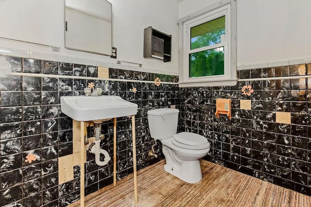 1036 Vilas St, Leavenworth, KS 66048 - half bath with toilet, a wainscoted wall, and tile walls