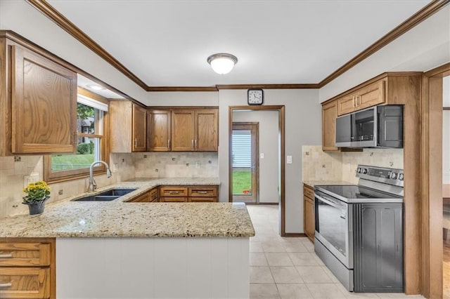 13003 W 77th Ter, Shawnee, KS 66216 - kitchen featuring stainless steel appliances, a sink, tasteful backsplash, a peninsula, and light tile patterned floors