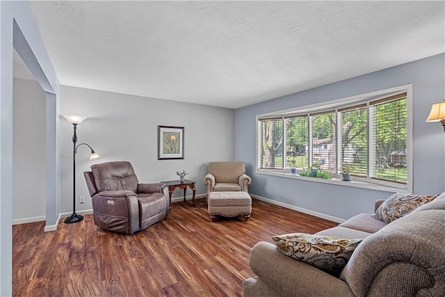 522 Kasold Dr, Lawrence, KS 66049 - living area with baseboards and wood finished floors