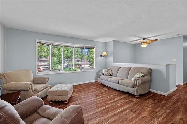 522 Kasold Dr, Lawrence, KS 66049 - living room with baseboards, wood finished floors, ceiling fan, and a textured ceiling
