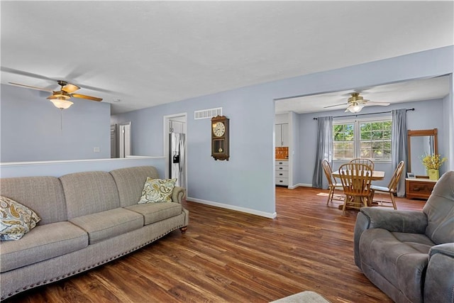 522 Kasold Dr, Lawrence, KS 66049 - living area with ceiling fan, wood finished floors, and baseboards