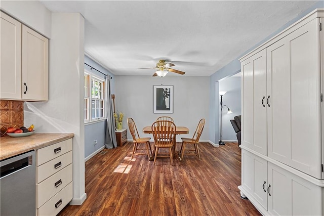 522 Kasold Dr, Lawrence, KS 66049 - dining space featuring a ceiling fan, baseboards, and dark wood finished floors