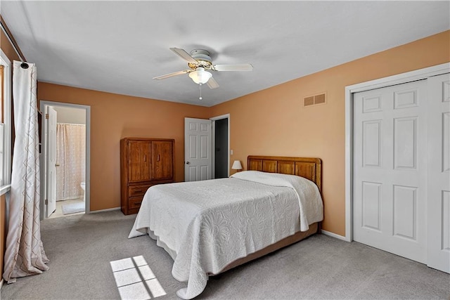 522 Kasold Dr, Lawrence, KS 66049 - bedroom with light colored carpet, baseboards, a ceiling fan, and connected bathroom