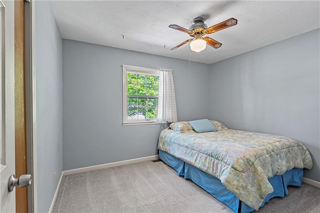 522 Kasold Dr, Lawrence, KS 66049 - bedroom featuring baseboards, carpet floors, and a ceiling fan