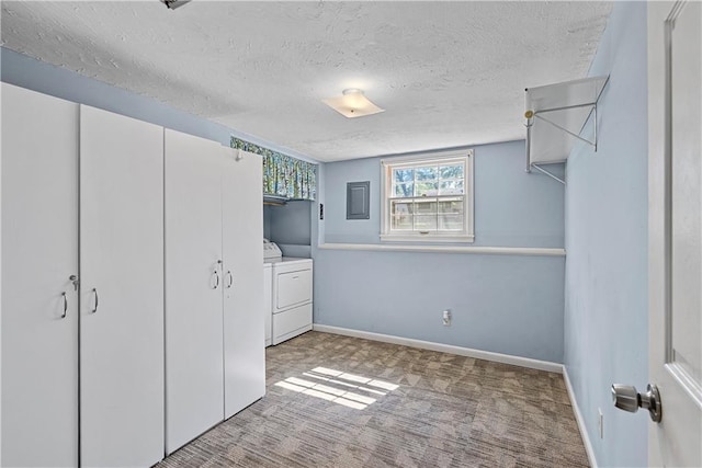 522 Kasold Dr, Lawrence, KS 66049 - unfurnished bedroom featuring washer and clothes dryer, a textured ceiling, electric panel, carpet floors, and baseboards