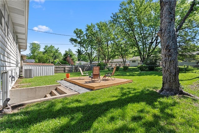 522 Kasold Dr, Lawrence, KS 66049 - view of yard featuring a deck and central air condition unit