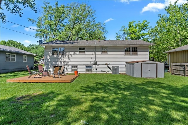 522 Kasold Dr, Lawrence, KS 66049 - rear view of property featuring a deck, a yard, and cooling unit