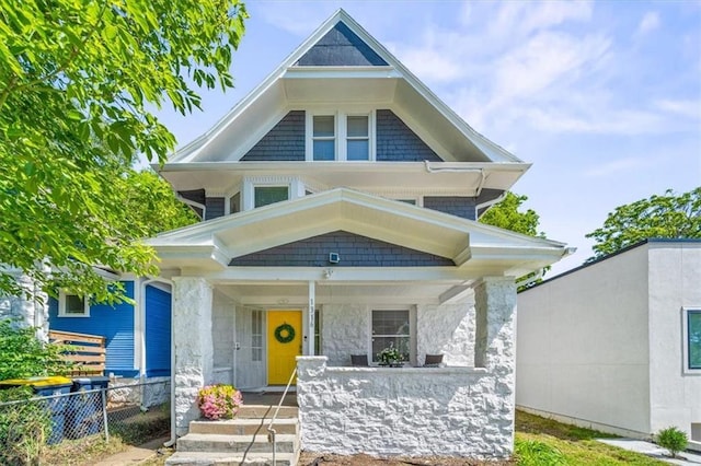 1316 E 42nd St, Kansas City, MO 64110 - view of front of property featuring covered porch and stone siding