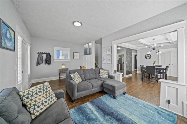1316 E 42nd St, Kansas City, MO 64110 - living area with stairs, a chandelier, wood finished floors, beam ceiling, and baseboards