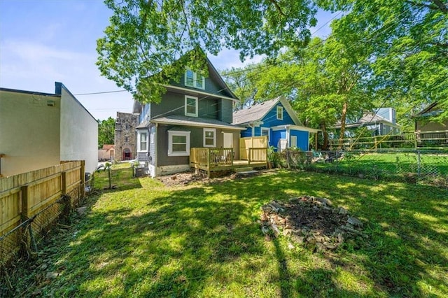 1316 E 42nd St, Kansas City, MO 64110 - rear view of property featuring a wooden deck